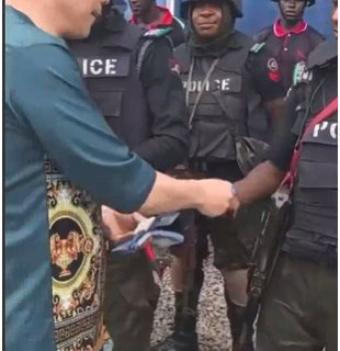 Outrage as Video Shows Chinese Giving Cash to Nigerian Policemen in Uniform